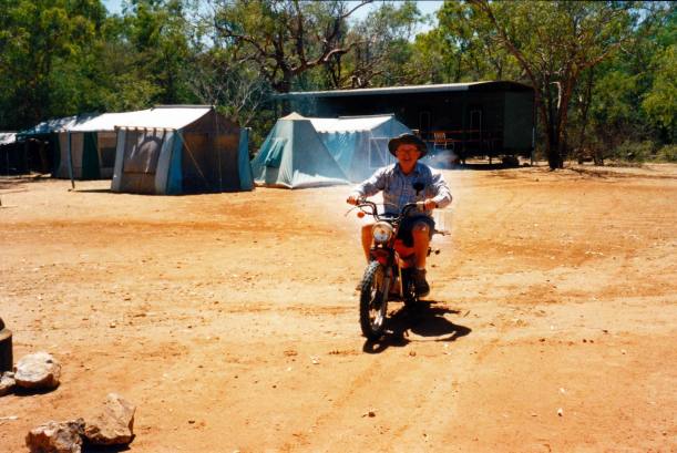 Resize of 08-07-2003 07 John on bike in camp area.jpg